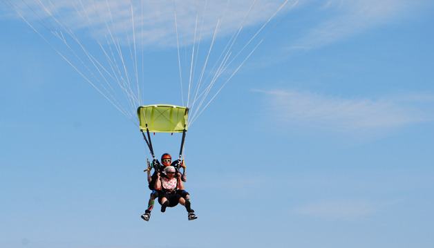 Dorothy Bell of Coupeville watches the ground approach after skydiving recently for her 81st birthday.