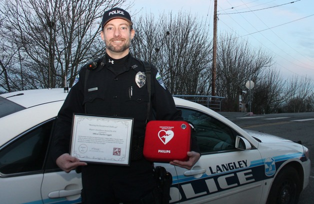 Langley Police Officer Charlie Liggitt was presented with a Mayor’s Excellence Award pin and certificate for using an automated external defibrillator