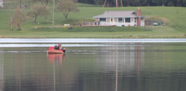 An angler fishes Lone Lake on South Whidbey. Fresh water fishing season opens at other lowland lakes on the South End and across the state this Saturday