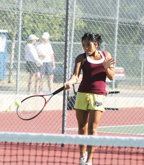 Lyna Nichols responds to teammate Kalie Stayskal’s serve last week during junior team tennis league play at South Whidbey High School