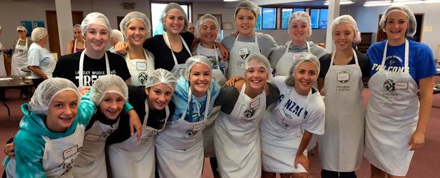 Members of the South Whidbey High School girls volleyball team coached by Mandy Jones assisted in the Children of the Nations meal packaging event at the Island Church of Whidbey in Langley on Aug. 22 and 23. 150 volunteers attended and packaged 40