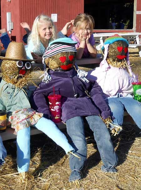 Mia Ollis and Bella Policy never ran out of energy during the scarecrow-building event at the Island County Fairgrounds Sunday
