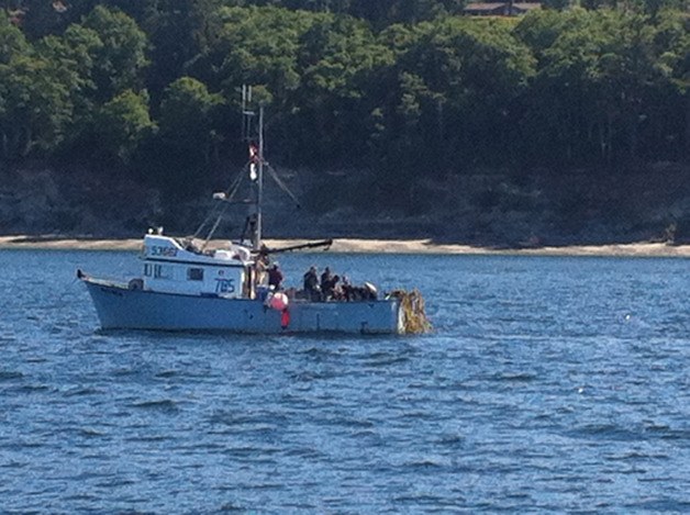 A dive crew prepares to enter the water off Central Whidbey near the Ledgewood neighborhood to attempt to recover a long-lost anchor some say is from Captain George Vancouver's visit to the Pacific Northwest.