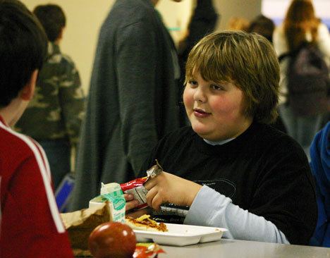 Sixth-grader Trevor Turpen talks with lunchmate Evan Mellish during lunch Tuesday at Langley Middle School.