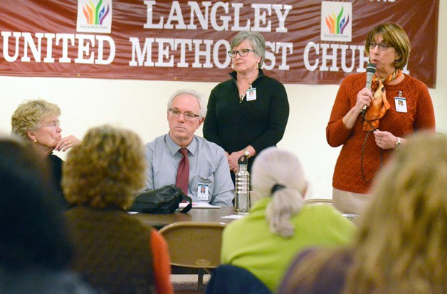 Whidbey General Hospital CEO Geri Forbes speaks in Langley Thursday during the first of a series of town hall meetings.
