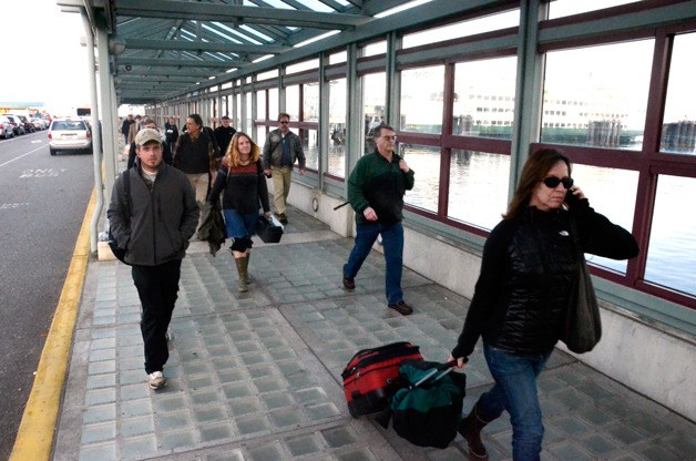 Walk on passengers disembark the ferry in Clinton Thursday afternoon. The Port of South Whidbey agreed this week to work with Langley on a project that could improve foot traffic on the route.