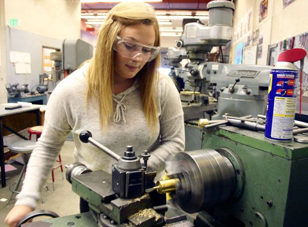 Taylor Jensen works on the hinge pins for the lantern room door of the Admiralty Head Lighthouse. The sophomore at South Whidbey High School just finished her first semester in the metals class that worked on most of the brass pieces.
