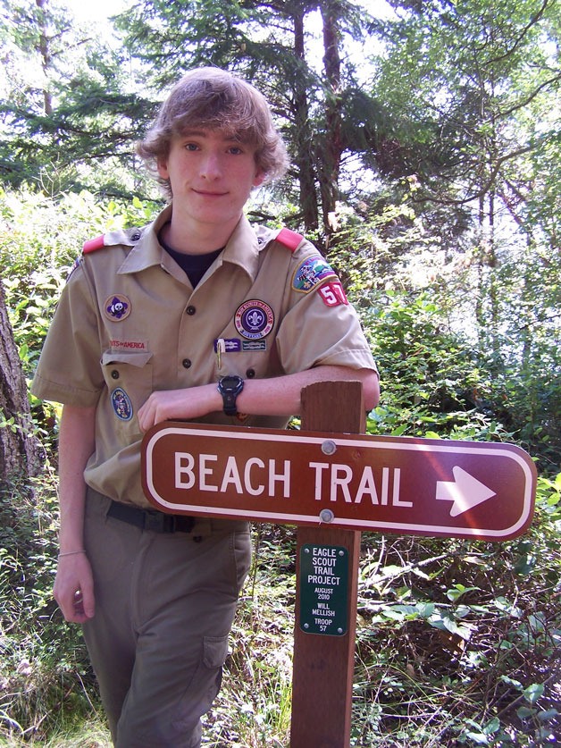 Will Mellish stands at the head of the Possession Point beach trail that he helped to clear.