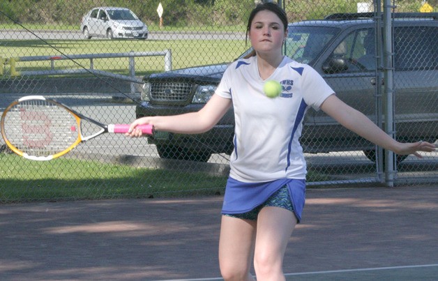 Breanna Gauger winds up for a forehand against Blaine in a doubles match April 25 at South Whidbey High School. She and partner Katrina Layton lost in three sets.