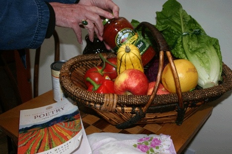 Molly Cook prepares a basket of food to inspire the spirit of giving.