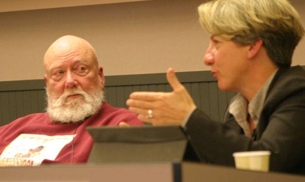 School Board Member Fred O'Neal listens as District Superintendent Jo Moccia talks about the latest enrollment figures at Wednesday's school board meeting.