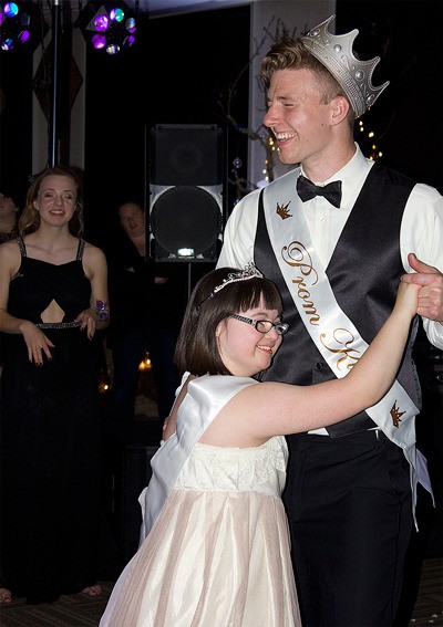 Talia Petosa and Angus Jones dance after being announced prom queen and king.