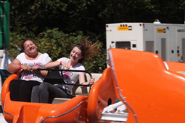 Maddie Heiser of Mill Creek and Taryn Cook of Mill Creek spin around in one of the rides at the Whidbey Island Fair. The girls were visiting Whidbey Island where Cook's grandmother