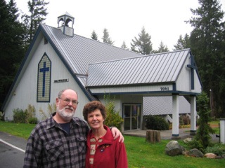 George and Lila Mills outside the historic church they purchased at French and Maxwelton roads in the Maxwelton Valley.