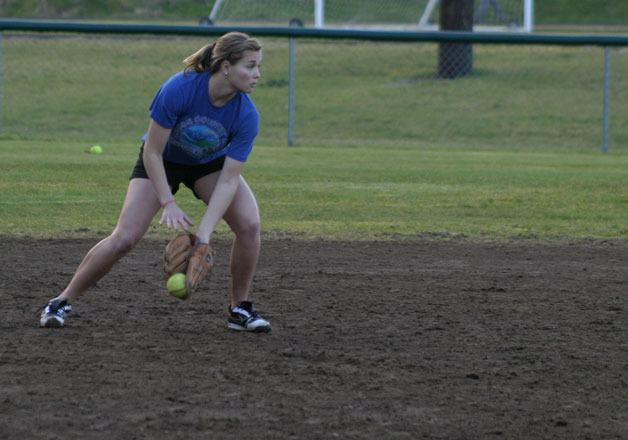 Chantal White fields a ground ball during drills with the Falcon softball team. It was one of the rare dry days the team was able to play on the field.
