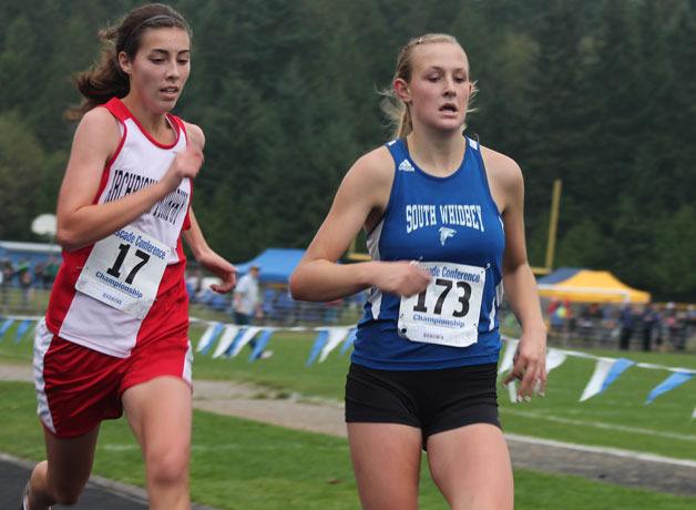Falcon freshman Anna Leski races Archbishop Murphy’s Lindsey Dorney on the final 100 meters of the Cascade Conference Championship meet Saturday at South Whidbey High School.