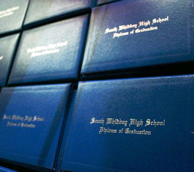 The stack of diploma covers for South Whidbey High School's class of 2012 sit on a table near the lectern.