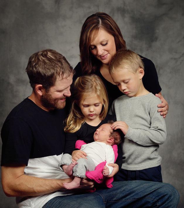 Blair RussLynn Allen is surrounded by her parents Carrie and Jason