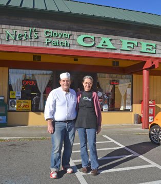 Owners Neil Colburn and Candy Culver stand in front of Neil’s Clover Patch Cafe. The owners are celebrating the cafe’s 30th anniversary this month.