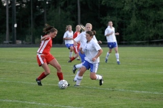Falcon defender Christine Johnson fights for the ball. Thursday