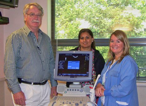 Dr. Robert Burnett and obstetric nurses Marie Salmeron and Monica Lodell with their new ultrasound.