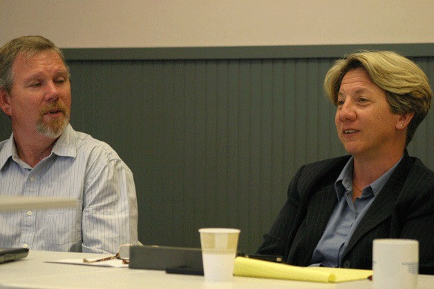 Dan Poolman listens to new school district superintendent Jo Moccia respond to discussion over the district's 2011-2012 budget.