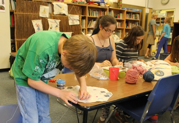 Students work on a fiber arts project during class on Thursday morning. These and other works will be displayed at the Whidbey Festival of the Arts.