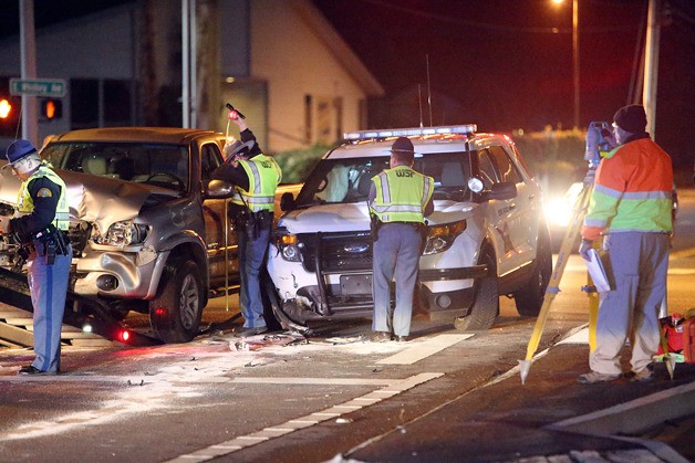Law enforcement officers inspect the Highway 20 crash Dec. 9.
