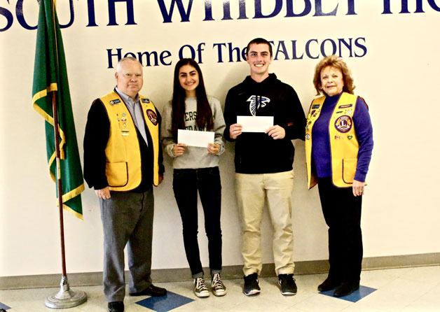 The South Whidbey Lions Club presented two South Whidbey High School seniors with scholarships at its bi-monthly meeting May 26 at the M Bar C Ranch. Macey Bishop and Chandler Hagglund were the recipients of $500 scholarships for having “excellent records