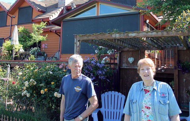 Gary and Janie Gabelein stand in their “farmhouse garden.” The garden surrounds their Clinton home that sits on two acres. The farmhouse is also utilized as a three-unit bed and breakfast.
