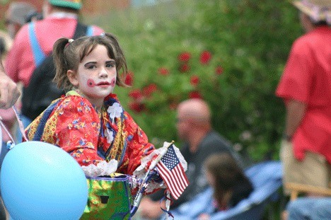 A young fourth of July reveler participates in the historic Maxwelton Community Independence Day Parade.