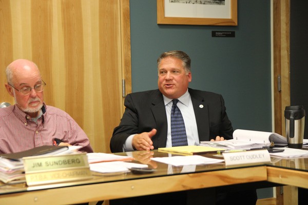 Island Transit board members Jim Sundberg and Scott Dudley attend a meeting.