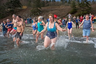 Cathy Darracott leads the charge into the icy waters of Double Bluff Beach in 2008.  The fifth annual Polar Bear Dive returns to Freeland Park beach Thursday. Registrations starts at 10:30 a.m.