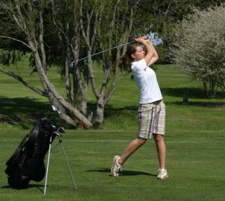 Falcon golfer Olivia Hamilton swings toward the green on the first hole Wednesday at Useless Bay Golf Club.