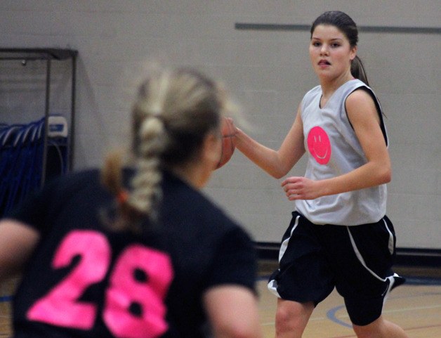 Falcon freshman Megan Drake brings the ball up the court during a recent practice. The girls varsity team will rely on young players who will need to improve quickly to compete in the Cascade Conference this season.