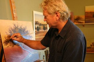 Oil painter Kent Lovelace works on a painting in his Black Sheep Studio in Freeland.