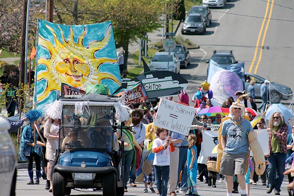 People walk up Second Street from Anthes Avenue for the annual Welcome the Whales Parade in Langley on April 18.
