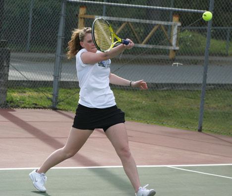 Falcon Alexa Brewster returns a serve during a match against the Lynden Lions on Wednesday. The girls team won