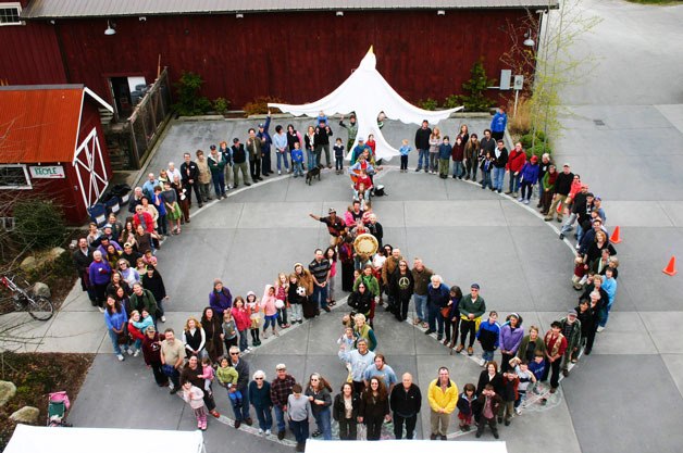 Every year on Earth Day at Bayview Corner folks gather for a peace symbol photo as they do here in 2009.