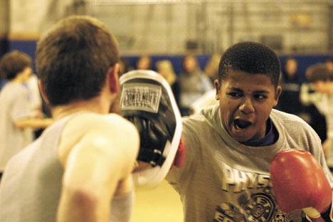 Langley Middle School seventh-grader Elijah Nichols practices his punches Thursday.