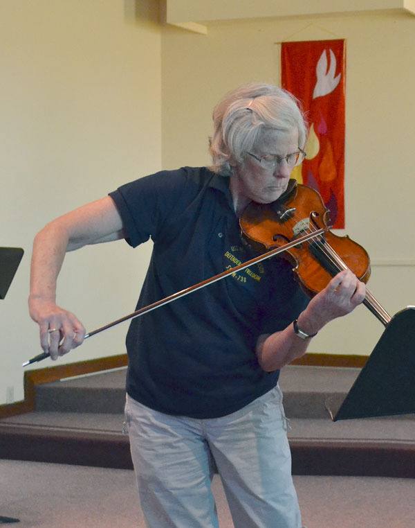 Violinist Patricia Laurence practices for her upcoming solo recital at 7:30 p.m. Sunday