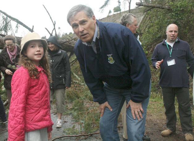 Gov. Jay Inslee speaks with 8-year-old Greta while he was touring the landslide that rocked Ledgewood last month.