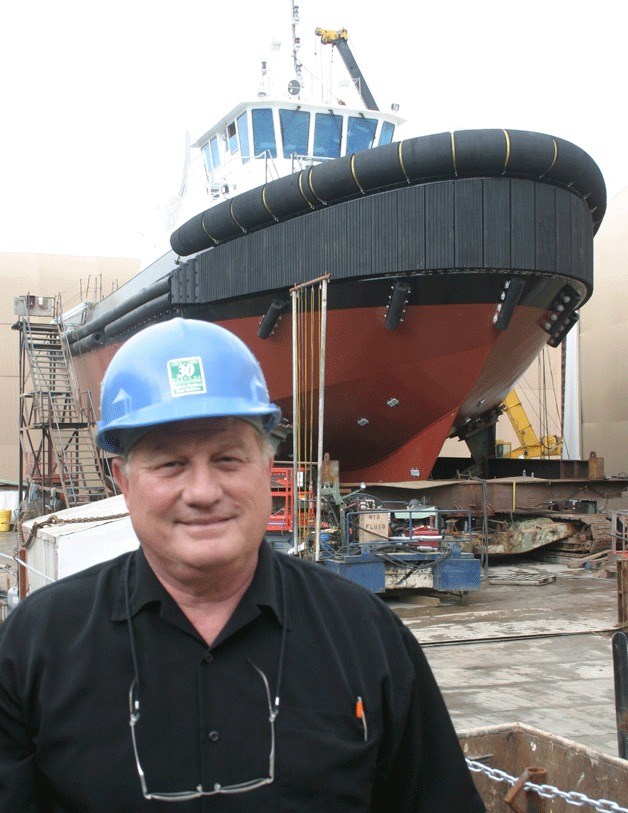 Matt Nichols with the company's last in a series of tractor tugs: 'We still have quite a bit of work going on.'