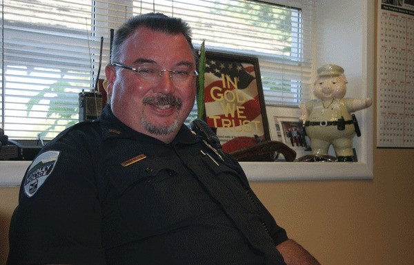 Langley Police Chief Randy Heston sits in his office moments before reporting to City Hall for the city  council meeting Aug. 5. After 10 years