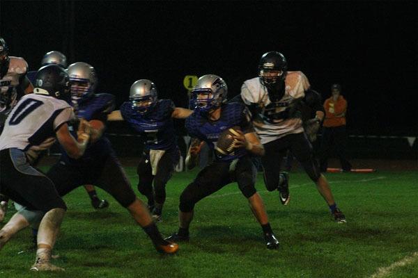 South Whidbey senior quarterback Charlie Patterson sits in the pocket while looking for an open receiver during Thursday night’s game against Sultan. The Falcons lost 34-32 on Senior Night.