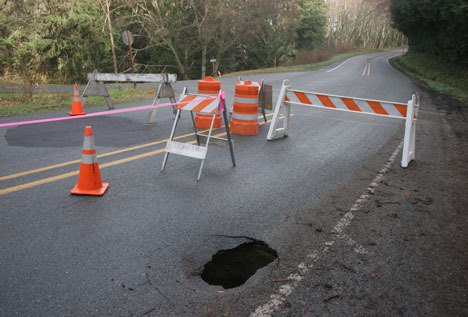 Bob Galbreath Road in Clinton has been closed after a sinkhole opened in the southbound lane. The patch for a sinkhole that closed the road last year can be seen in the northbound lane.