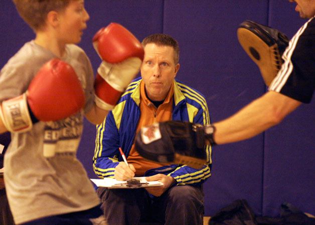 Principal Rod Merrell sits in as a judge as students in Langley Middle School’s boxing fitness program undergo skills testing on Thursday. Merrell has announced his departure as the head of LMS and South Whidbey High School. He will take over as principal at Mount Vernon High School in July.