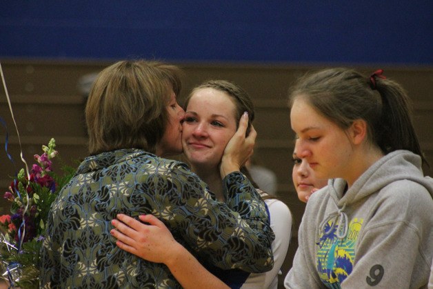 Sarah Merrow embraces her mom during the Falcon senior's introduction Monday night