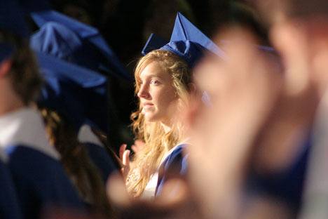Julie Iversen waits for her name to be called as teacher Andy Davis announces the 2010 graduates.