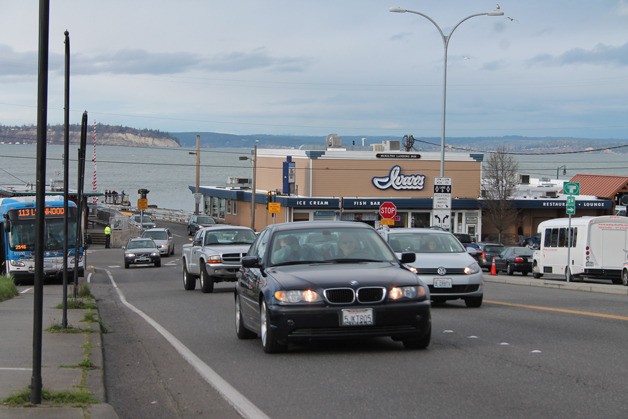 Vehicles offload from a ferry at the Mukilteo terminal Feb. 18. A proposed redesign would consolidate two lanes of southbound ferry traffic into one lane.